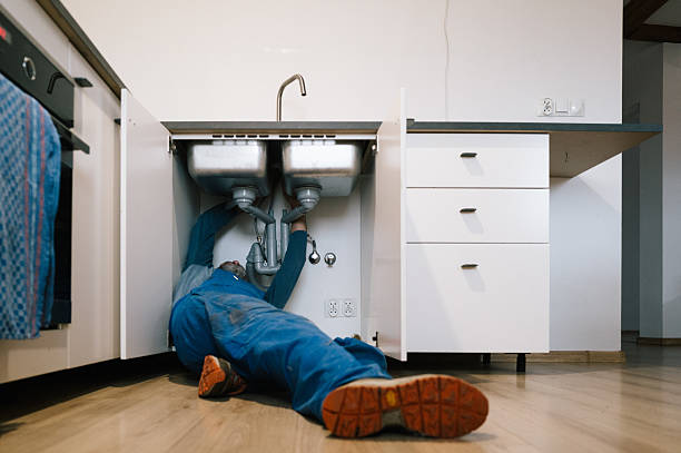 Professional Drain Cleaning technician working in Mc Dade, TX